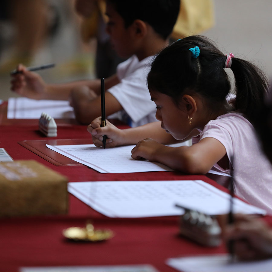 Child practising calligraphy